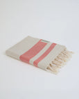 Bebe Turkish towel in Terra – Neatly folded towel, compact and ready for use
