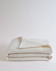 Summer Blanket in Naturel – Neatly folded blanket with visible label and soft gauze texture