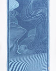 Blue towel with wave pattern on a white background