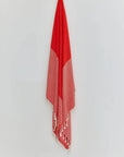 Alcazar Turkish towel in Red Charm – Full-length hanging view showcasing entire pattern and texture