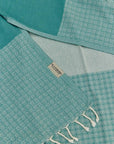 Alcazar Turkish towel in Sage – Close-up draped towel showing detail and texture