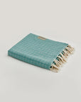 Alcazar Turkish towel in Sage – Neatly folded towel, compact and ready for use