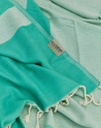 Comb Turkish towel in Crystal Green – Close-up draped towel showing detail and texture