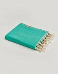 Comb Turkish towel in Crystal Green – Neatly folded towel, compact and ready for use