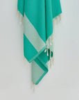 Comb Turkish towel in Crystal Green – Close-up hanging towel highlighting weave and softness