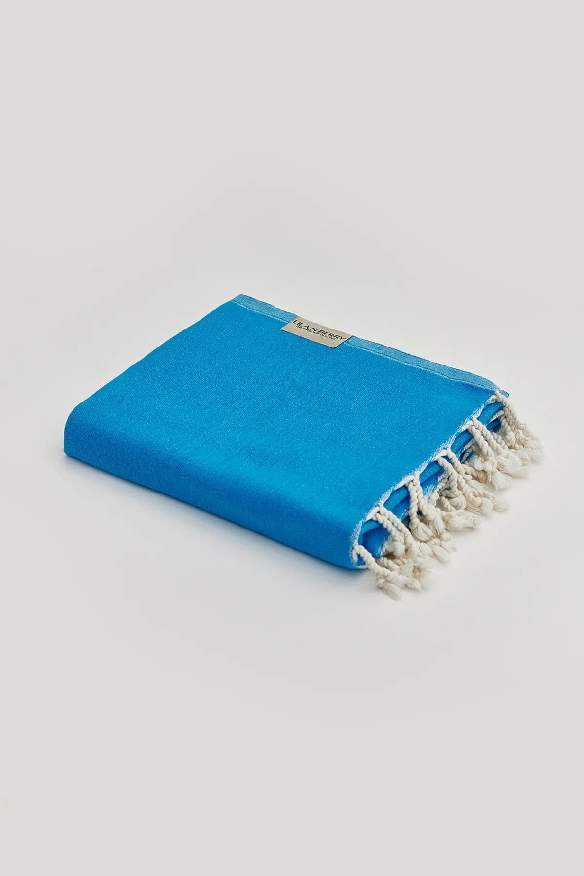 Comb Turkish towel in Marine – Neatly folded towel, compact and ready for use