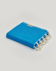 Comb Turkish towel in Marine – Neatly folded towel, compact and ready for use