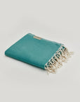 Comb Turkish towel in Sage – Neatly folded towel, compact and ready for use