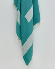 Comb Turkish towel in Sage – Close-up hanging towel highlighting weave and softness