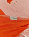 Comb Turkish towel in Sicilian Orange – Close-up draped towel showing detail and texture