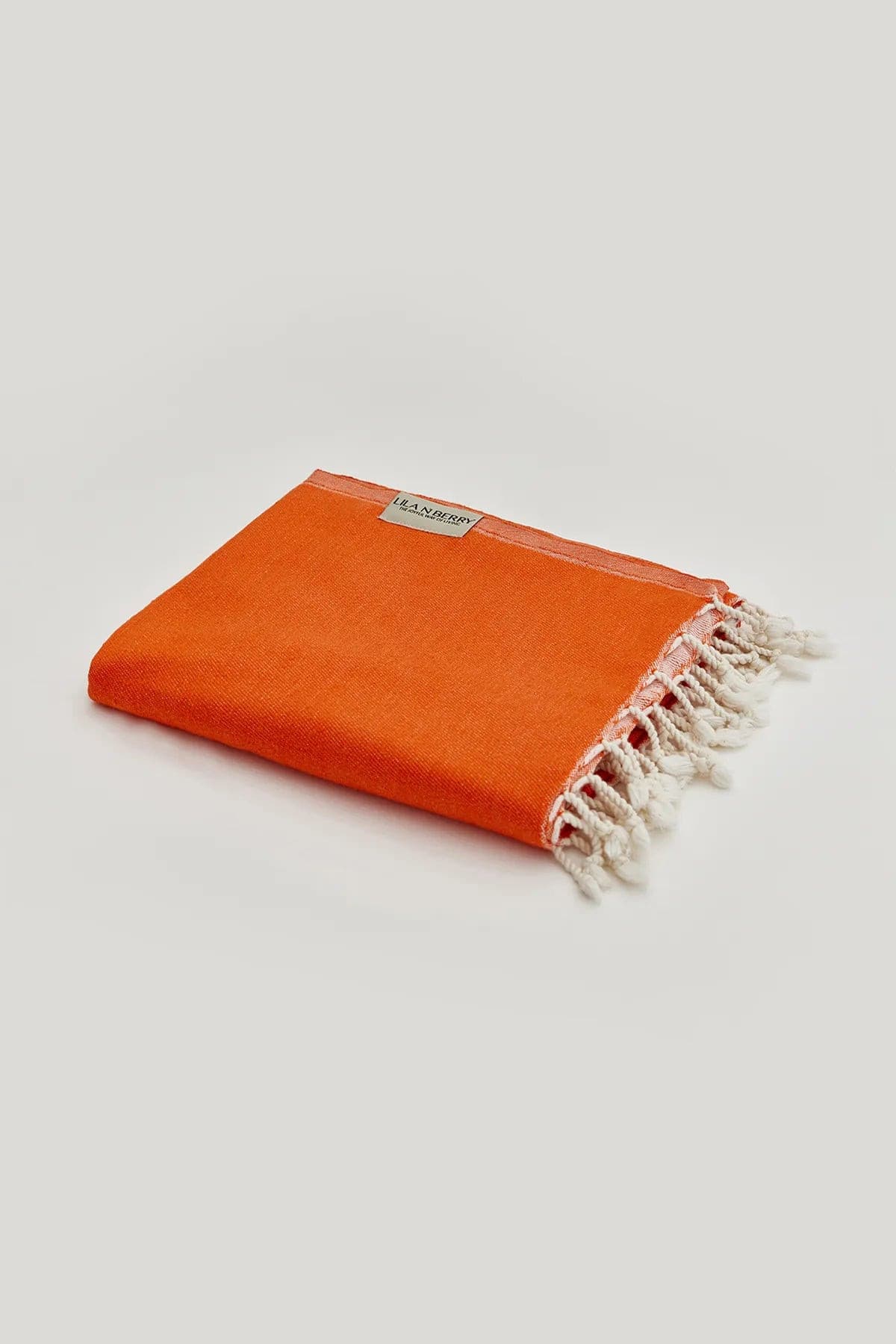 Comb Turkish towel in Sicilian Orange – Neatly folded towel, compact and ready for use