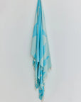 Fiori Turkish towel in Sky Blue – Full-length hanging view showcasing entire pattern and texture
