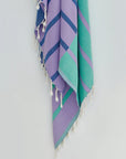 Lane Turkish towel in Lilac Green – Close-up hanging towel highlighting weave and softness
