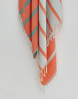 Lane Turkish towel in Peach Cream – Close-up hanging towel highlighting weave and softness