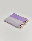 La Luna Turkish towel in Lilac – Neatly folded towel, compact and ready for use