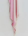 La Luna Turkish towel in Pink Blush – Close-up hanging towel highlighting weave and softness