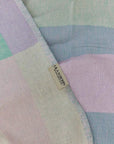 Pale Pluie Turkish towel in Mellow Green – Close-up draped towel showing detail and texture
