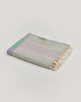 Pale Pluie Turkish towel in Mellow Green – Neatly folded towel, compact and ready for use