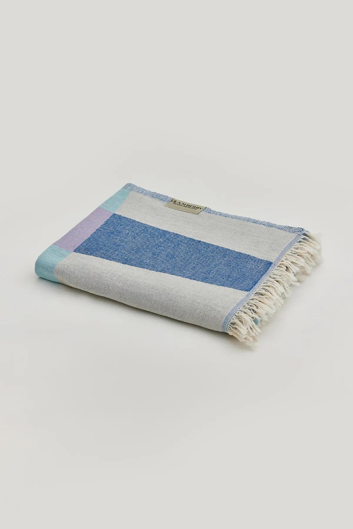 Pale Pluie Turkish towel in Mellow Indigo – Neatly folded towel, compact and ready for use
