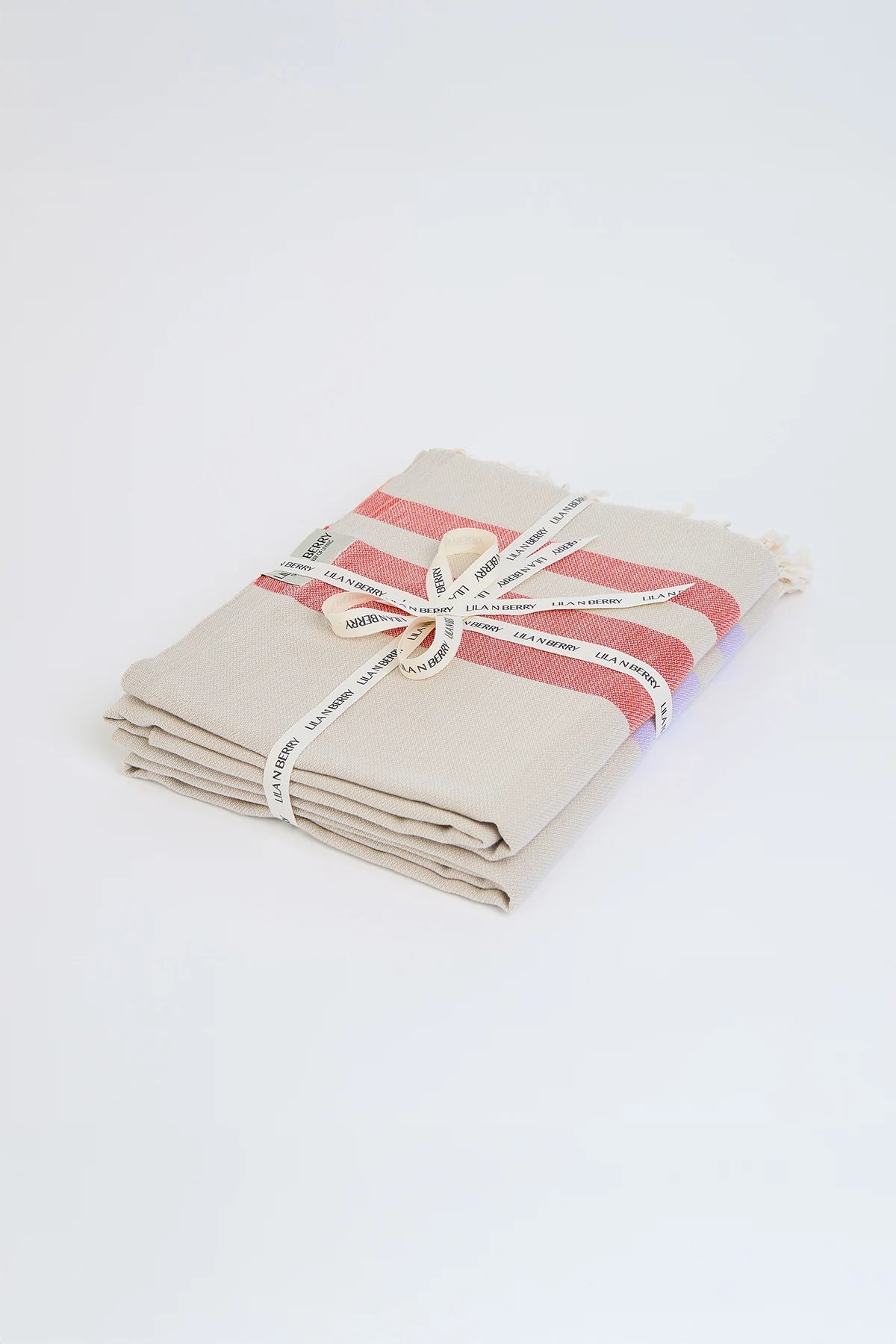 Bebe Dune Bundle – Folded bundle with multiple towels, tied with LILA N BERRY ribbon