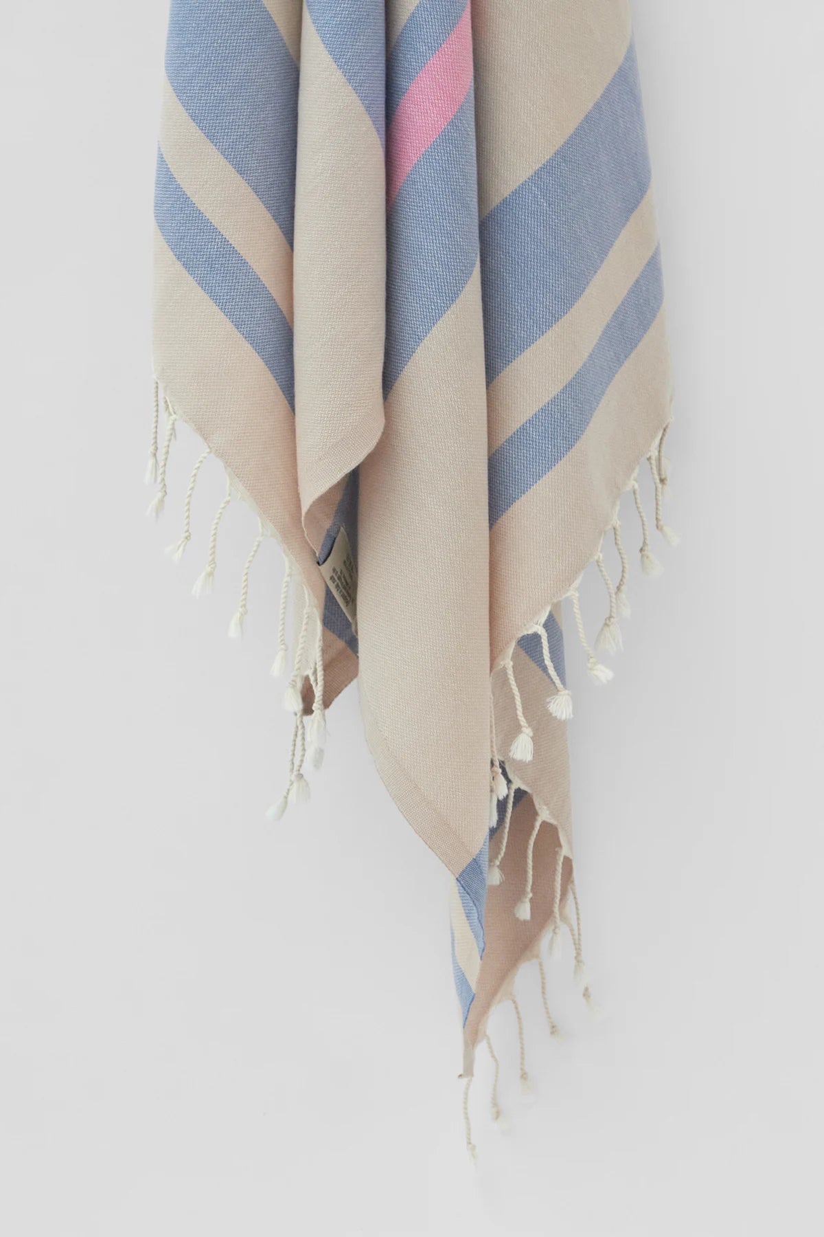 Bebe Turkish towel in Indigo – Close-up hanging towel highlighting weave and softness
