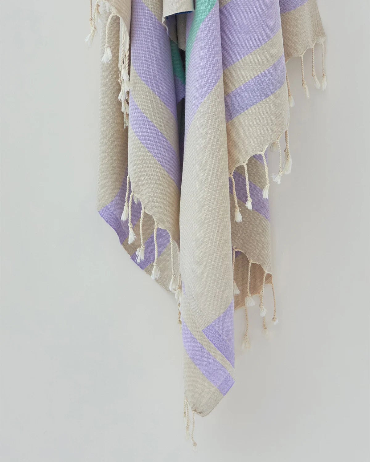 Bebe Turkish towel in Lilac – Close-up hanging towel highlighting weave and softness