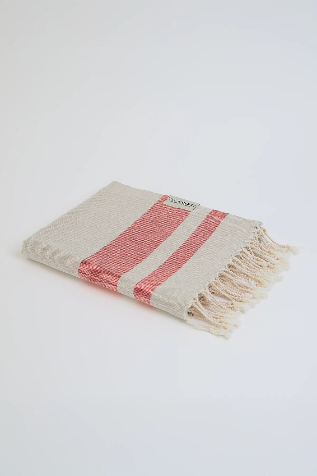 Bebe Turkish towel in Terra – Neatly folded towel, compact and ready for use
