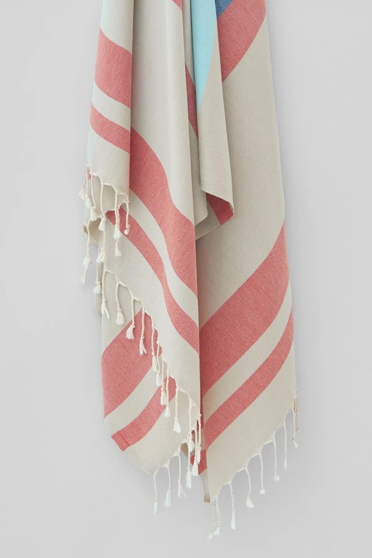 Bebe Turkish towel in Terra – Close-up hanging towel highlighting weave and softness