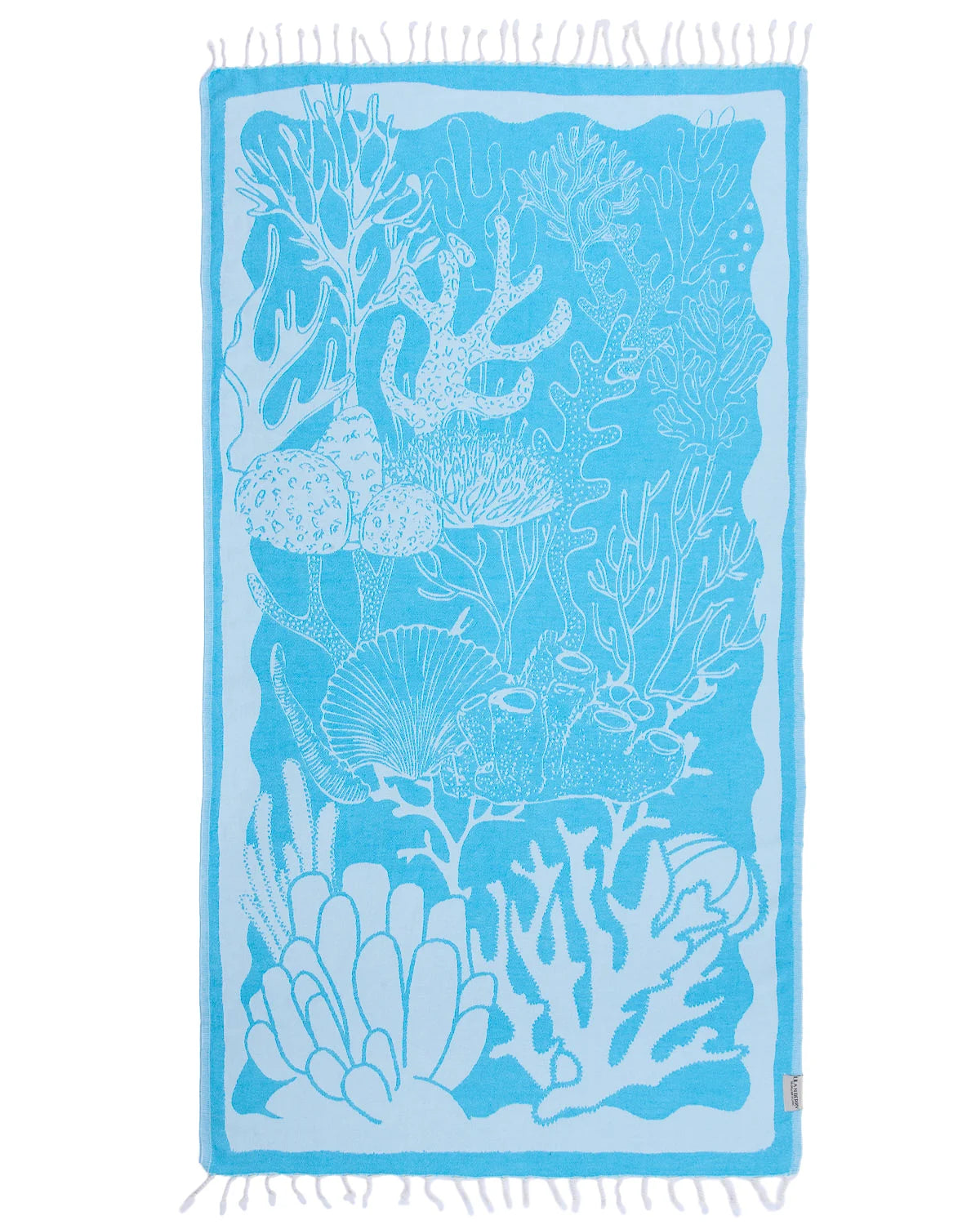 Blue beach towel with coral and shell pattern on a white background