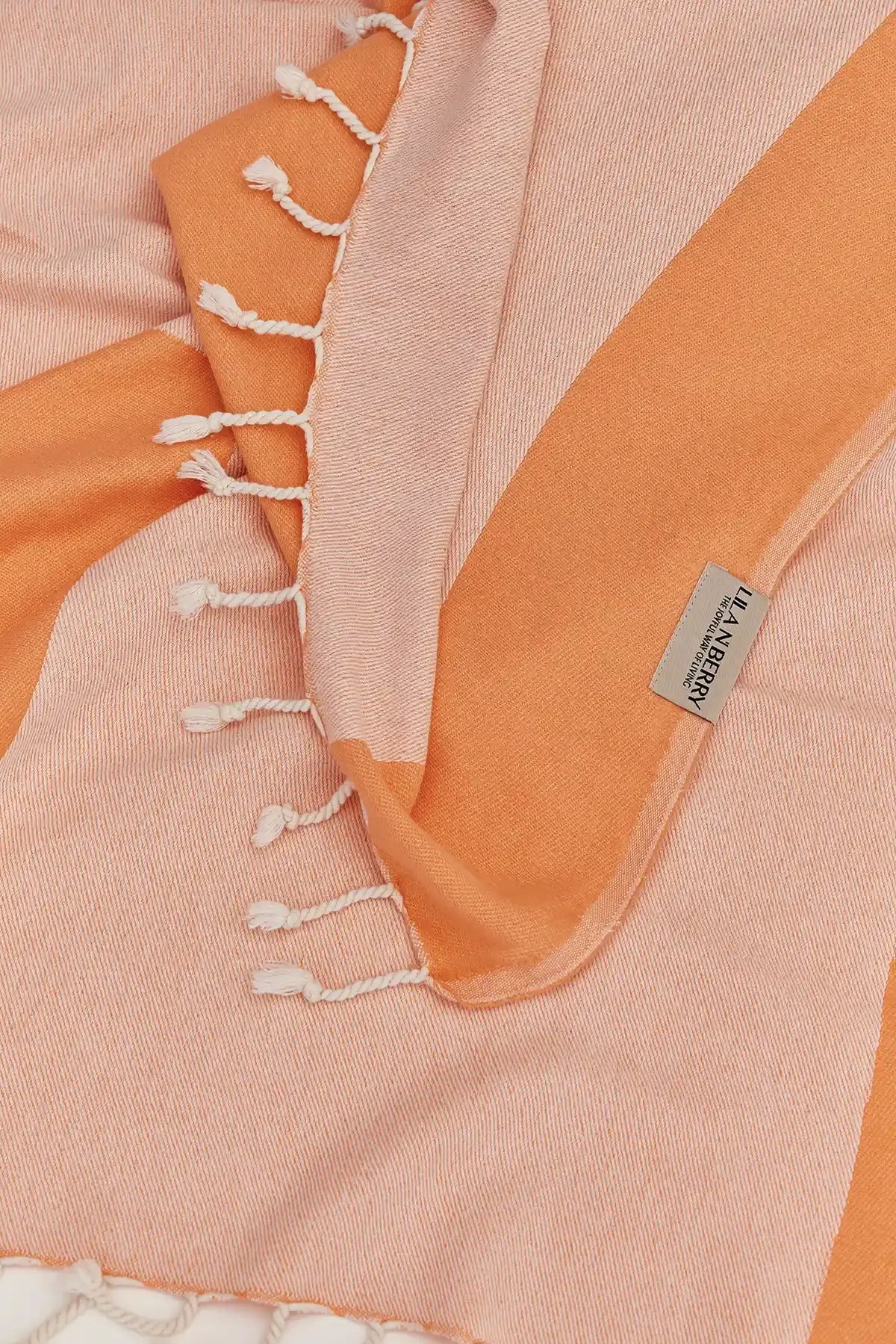 La Luna Turkish towel in Peach – Close-up draped towel showing detail and texture