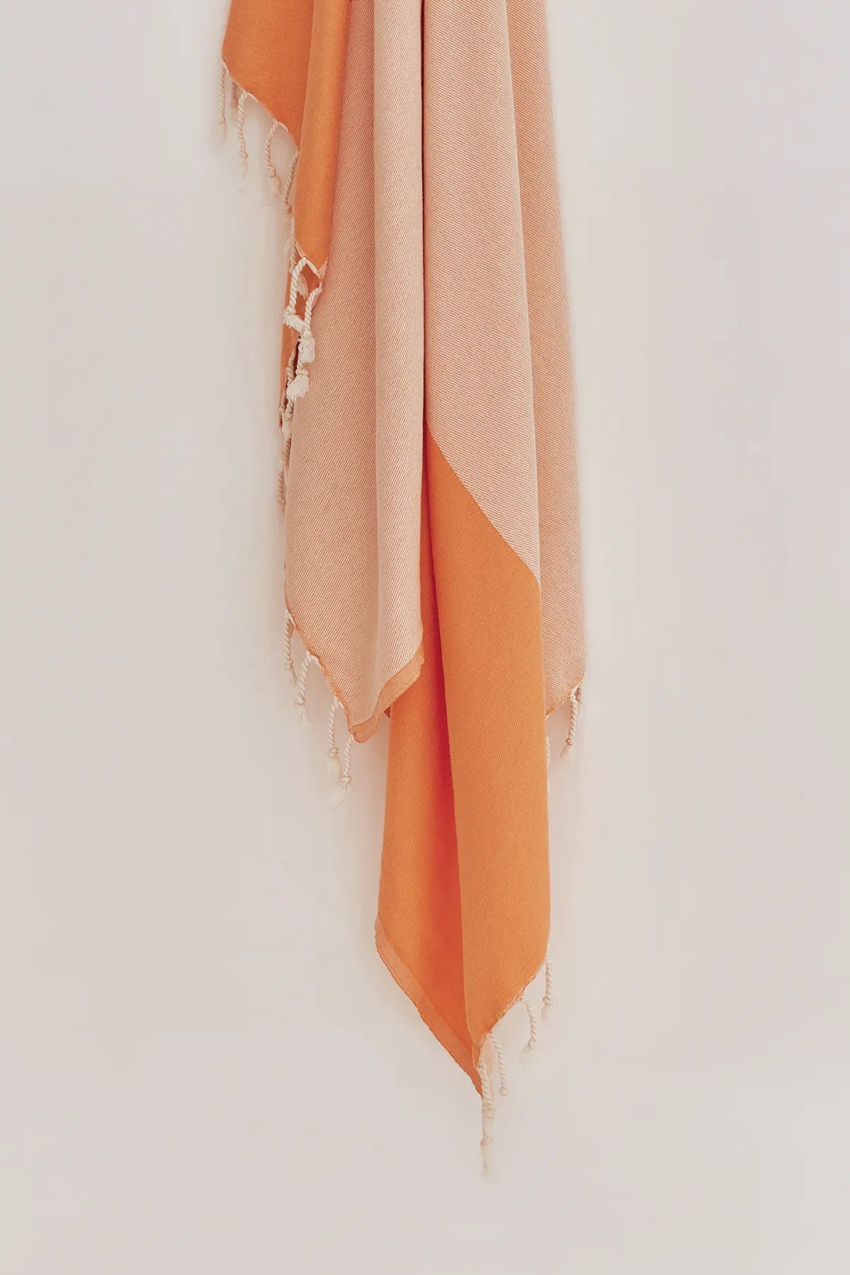 La Luna Turkish towel in Peach – Close-up hanging towel highlighting weave and softness