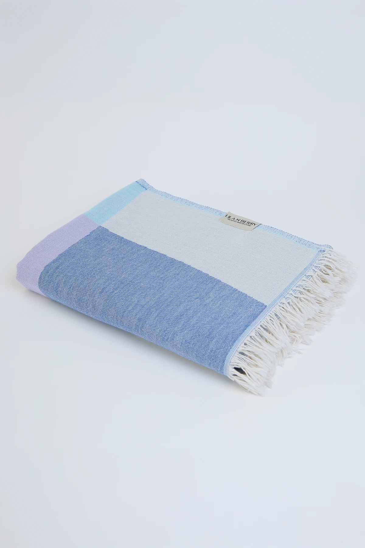 Pale Pluie Indigo X-Large Turkish towel in Mellow Indigo – Neatly folded towel, compact and ready for use