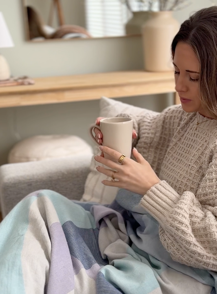 Pale Pluie X-Large towel in Mellow Indigo – used as cozy throw blanket while enjoying coffee at home