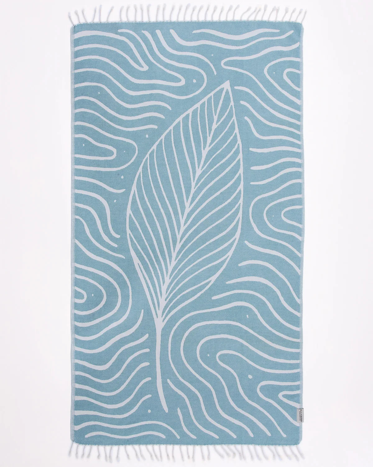 Blue towel with white leaf pattern on a white background