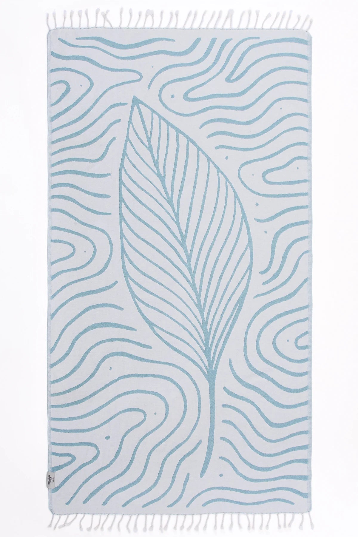 Towel with leaf pattern and fringe on a white background