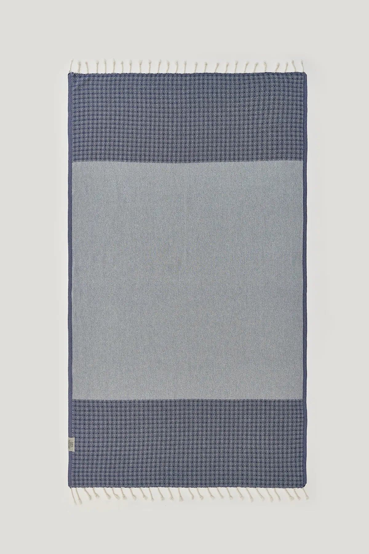 Alcazar Turkish towel in Indigo – Flat lay back side showing reverse weave