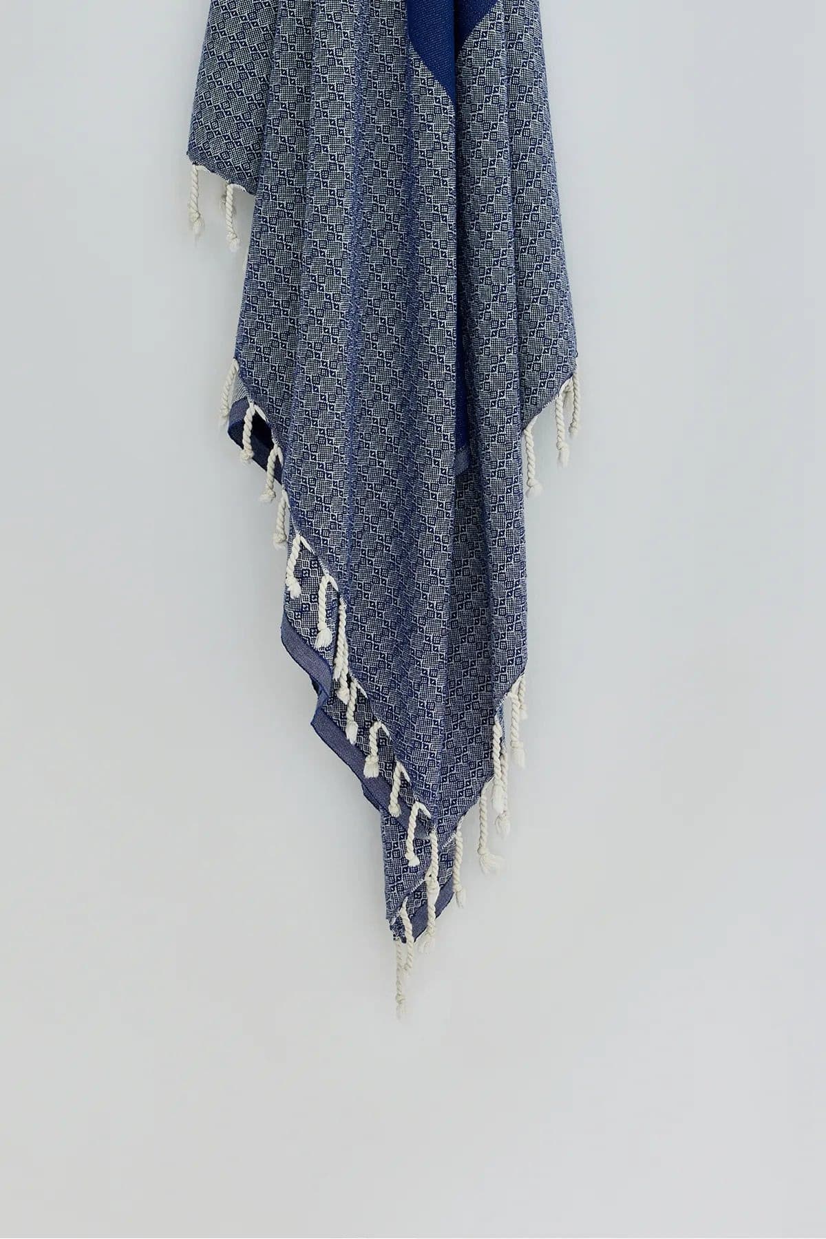 Alcazar Turkish towel in Indigo – Close-up hanging towel highlighting weave and softness