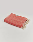 Alcazar Turkish towel in Red Charm – Neatly folded towel, compact and ready for use