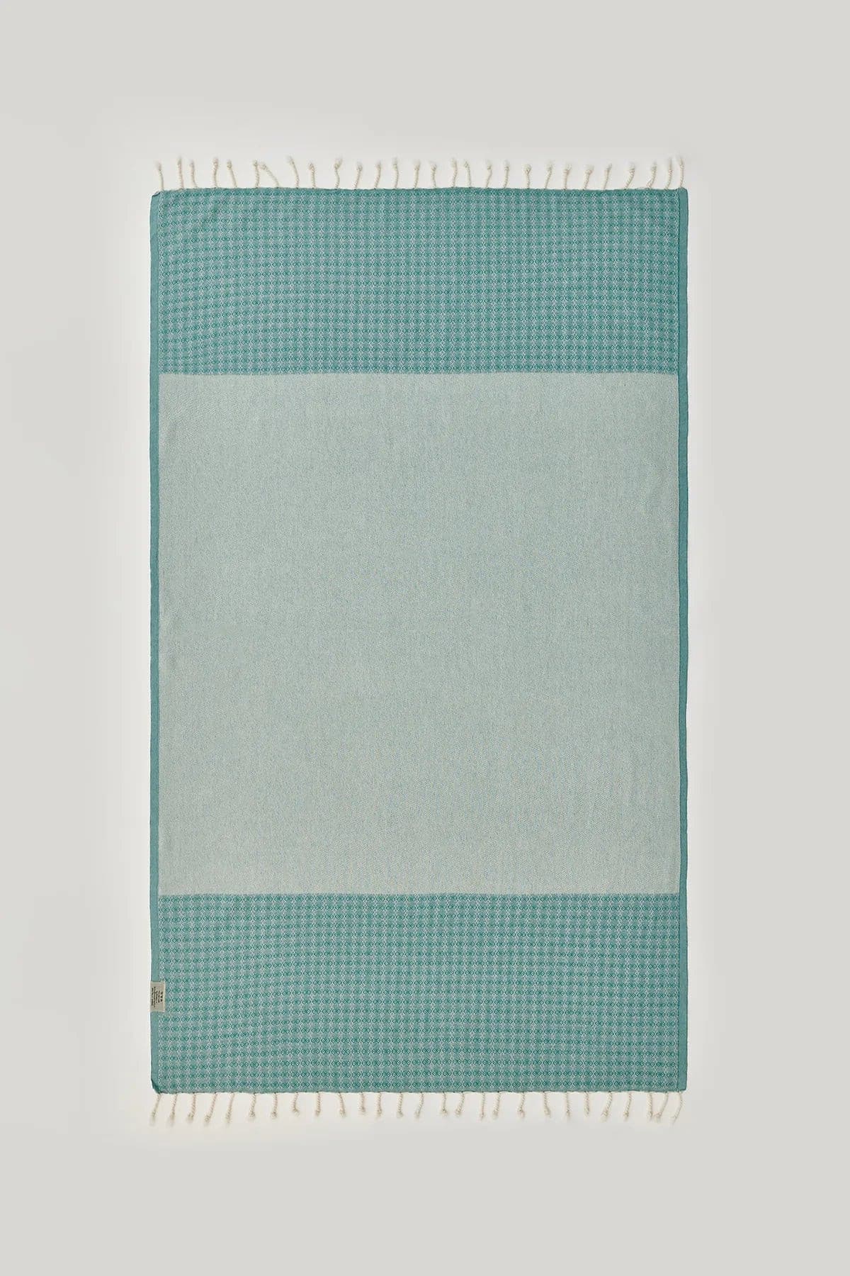 Alcazar Turkish towel in Sage – Flat lay back side showing reverse weave