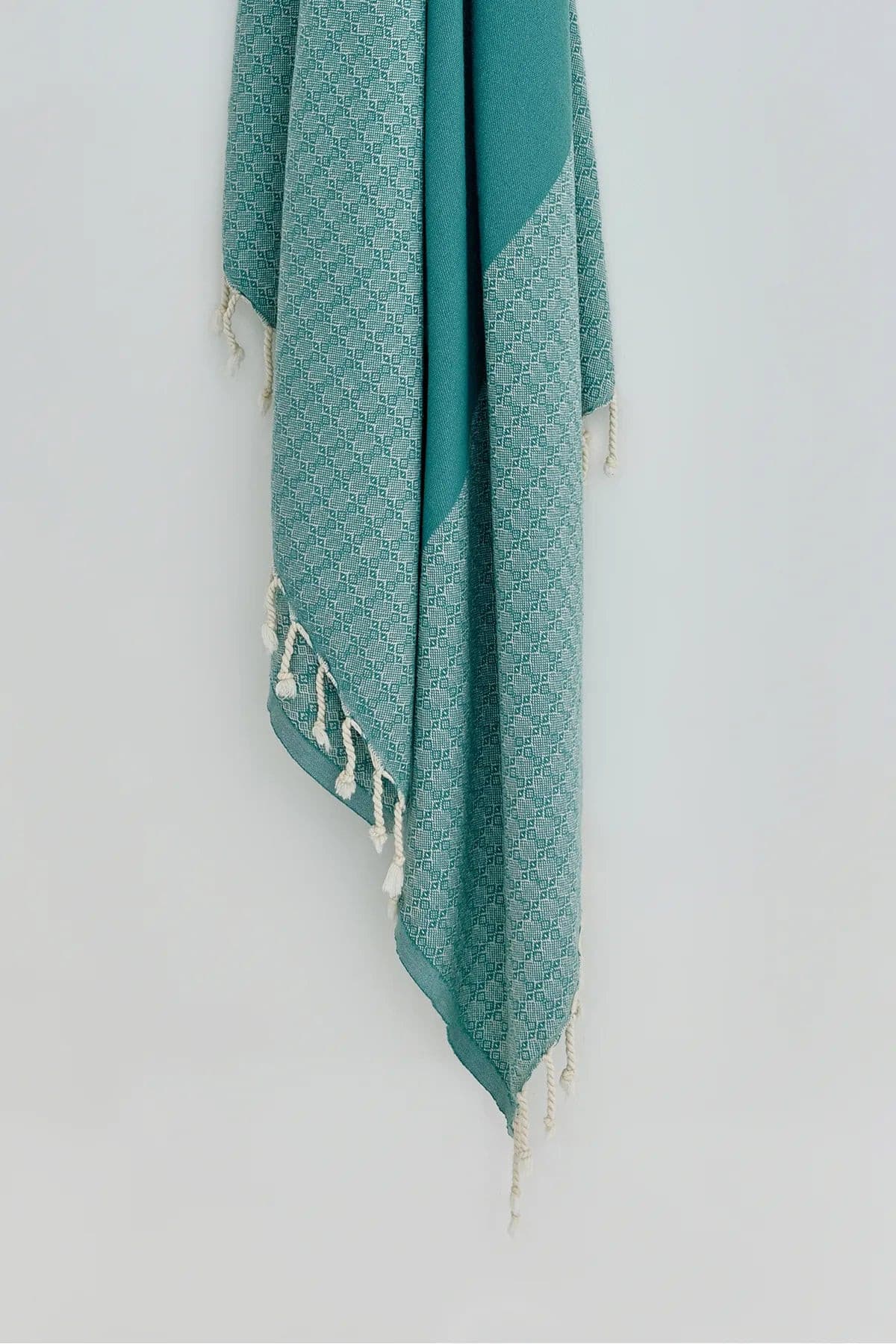 Alcazar Turkish towel in Sage – Close-up hanging towel highlighting weave and softness