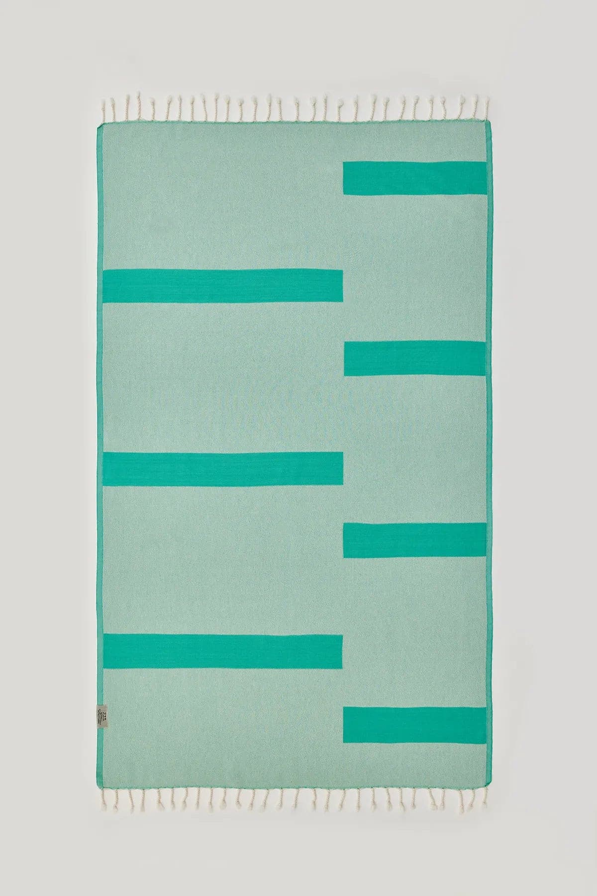 Comb Turkish towel in Crystal Green – Flat lay back side showing reverse weave