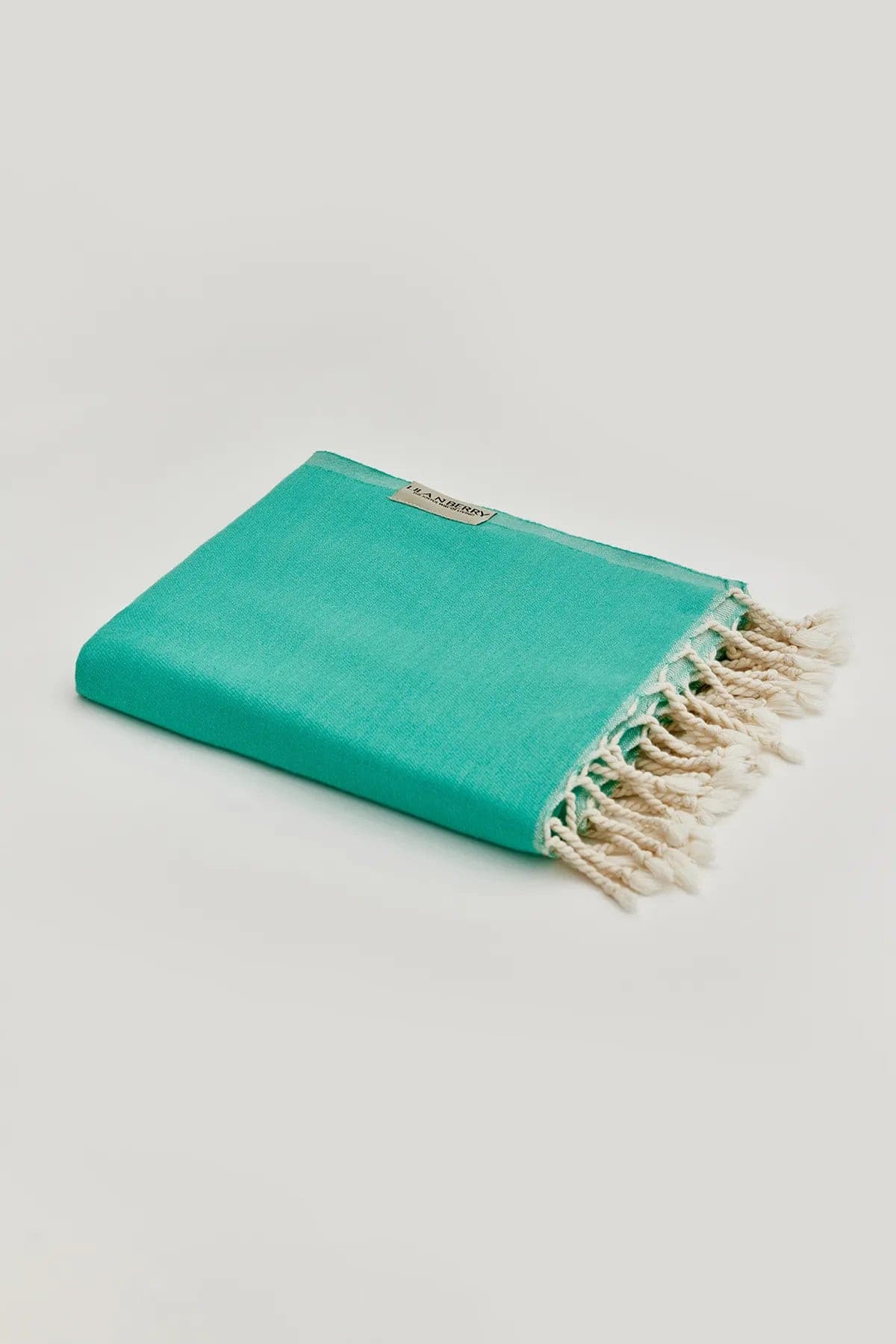 Comb Turkish towel in Crystal Green – Neatly folded towel, compact and ready for use