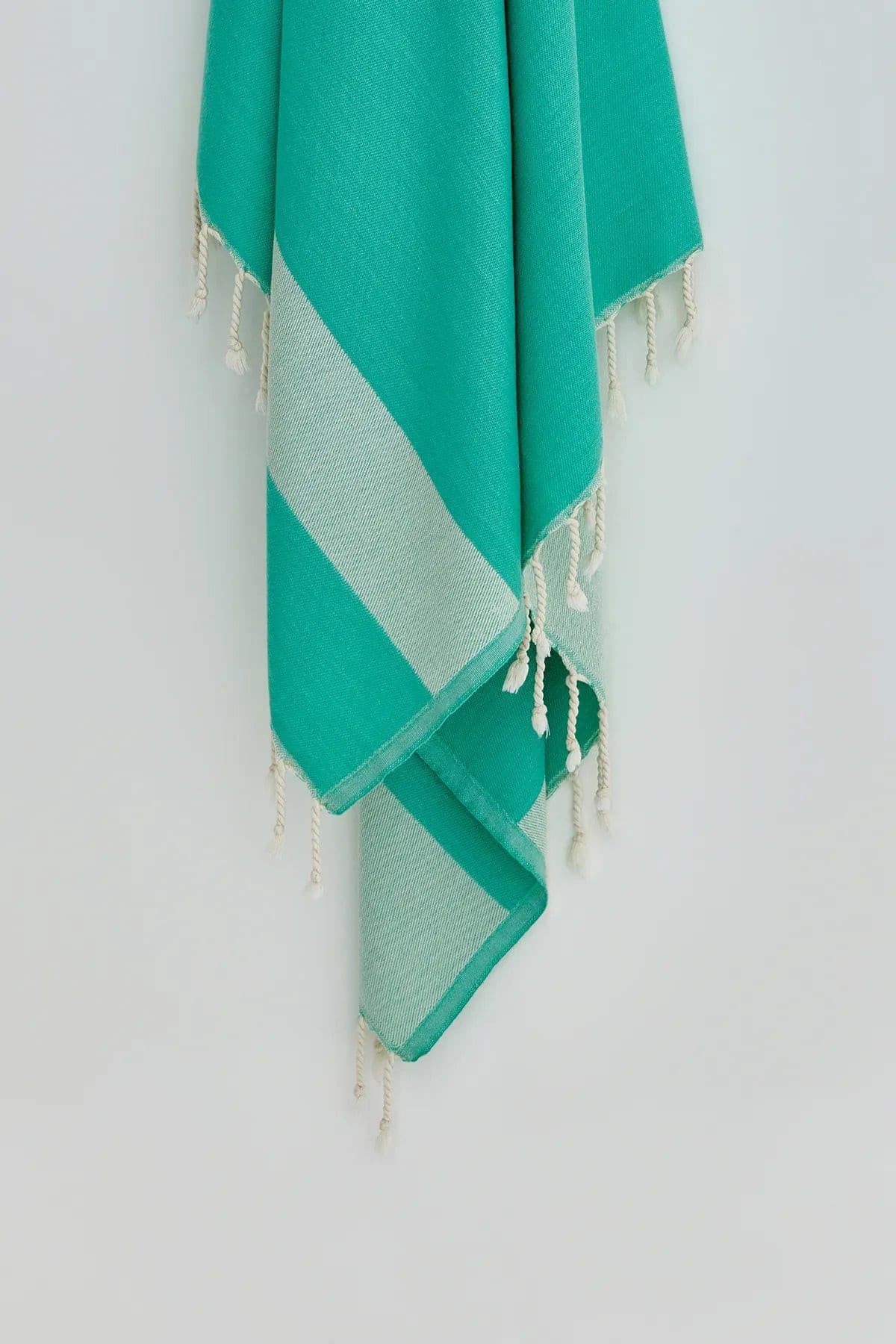 Comb Turkish towel in Crystal Green – Close-up hanging towel highlighting weave and softness