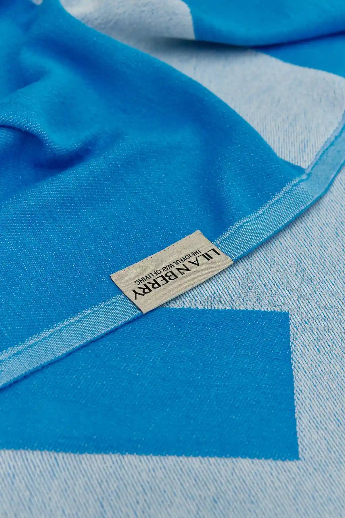 Comb Turkish towel in Marine – Close-up draped towel showing detail and texture