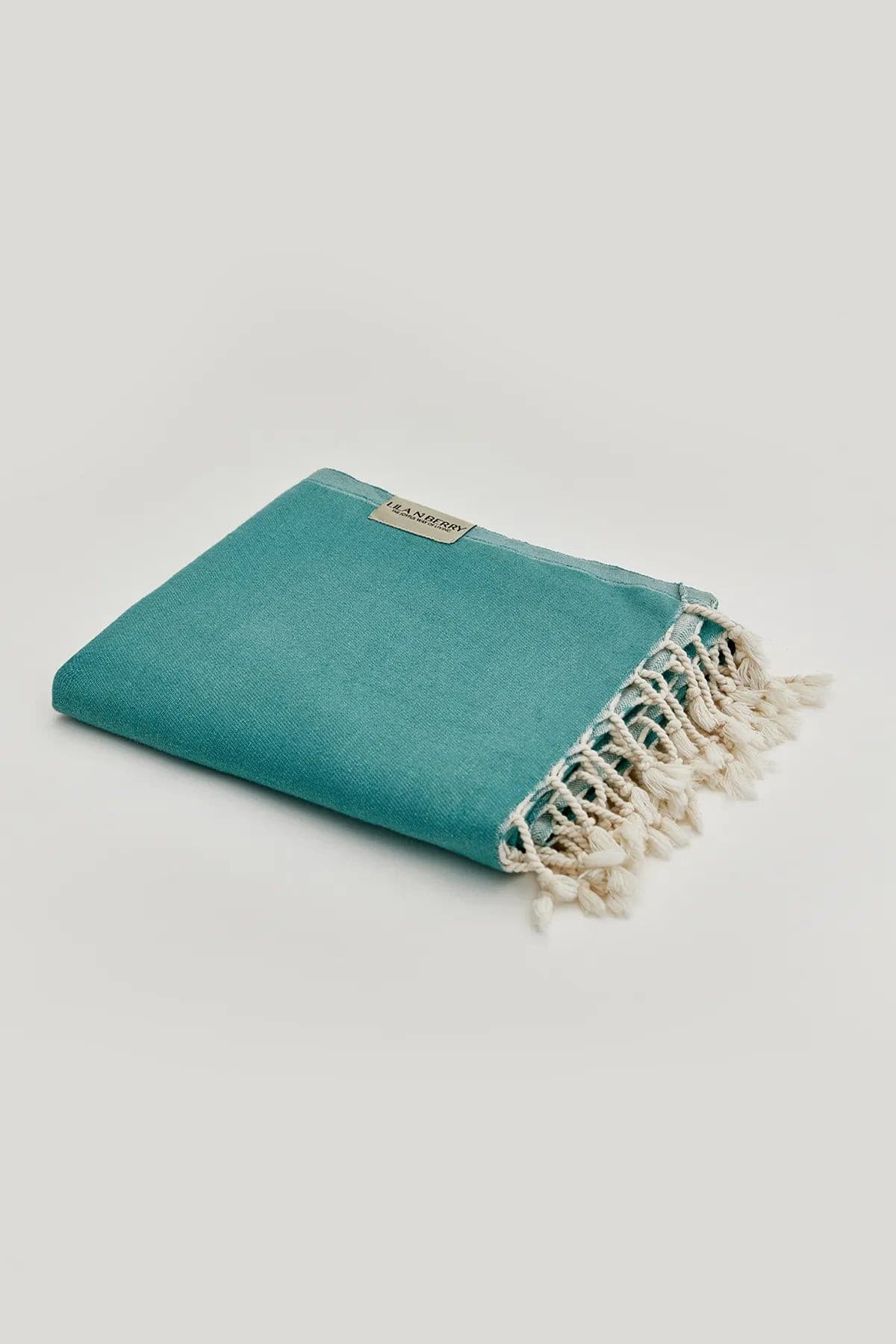Comb Turkish towel in Sage – Neatly folded towel, compact and ready for use