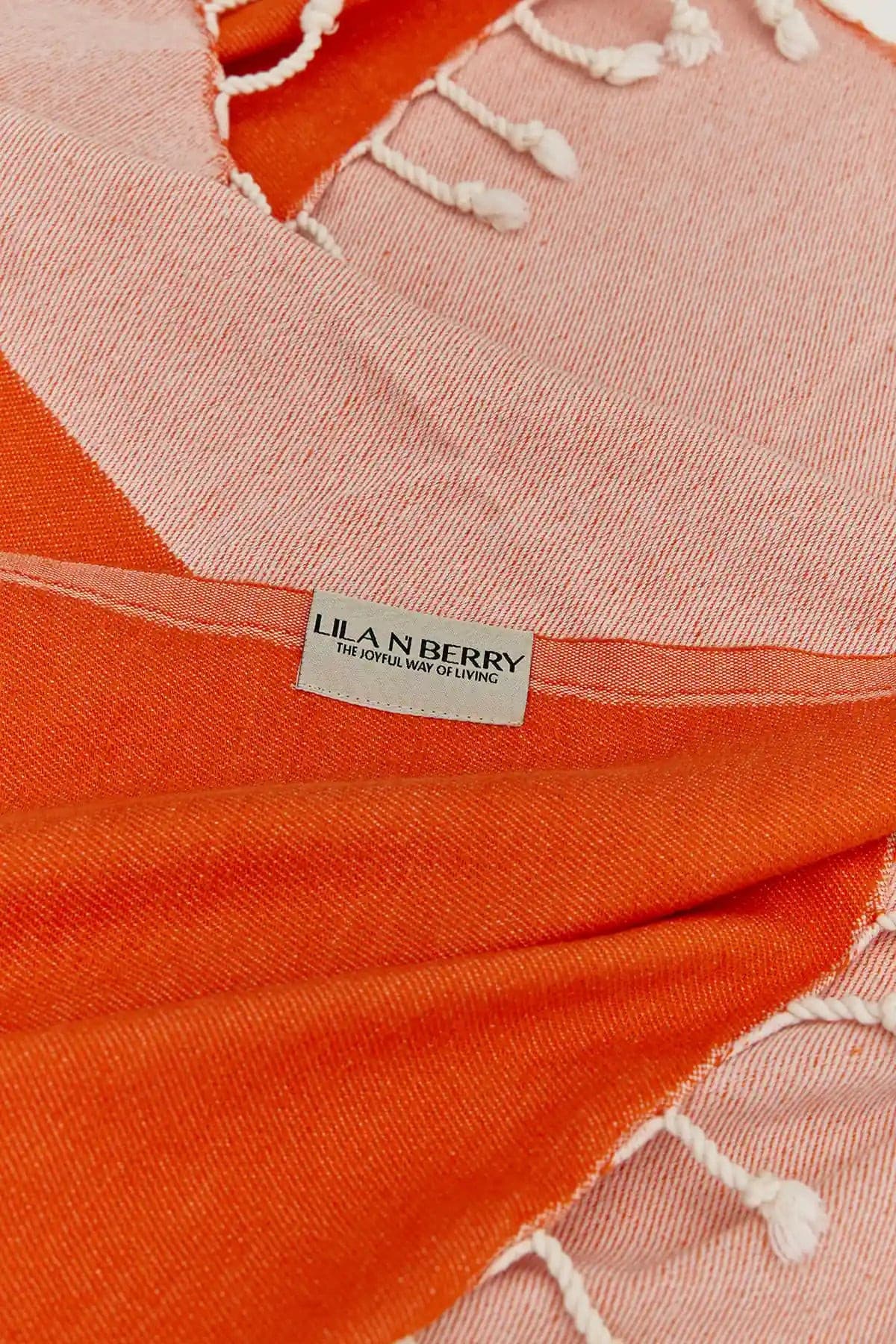 Comb Turkish towel in Sicilian Orange – Close-up draped towel showing detail and texture