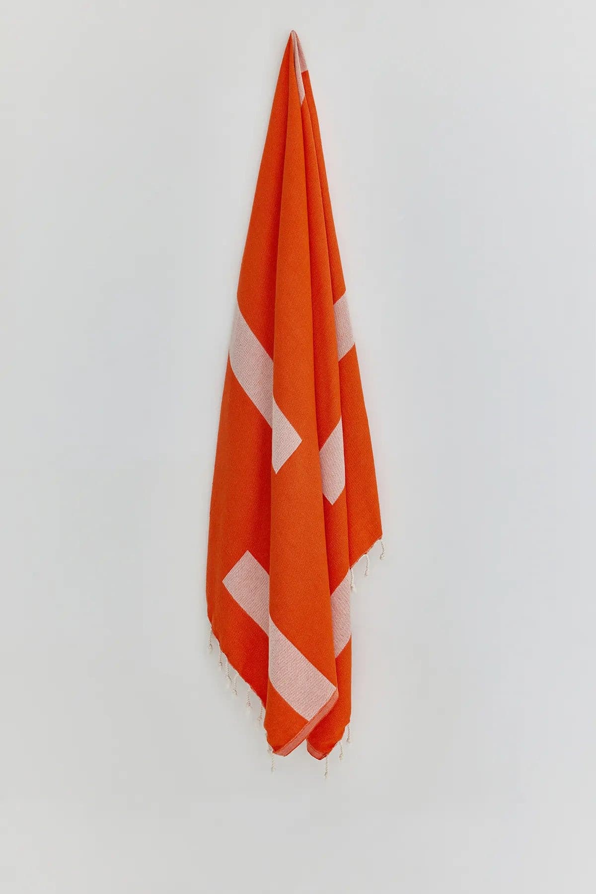 Comb Turkish towel in Sicilian Orange – Full-length hanging view showcasing entire pattern and texture
