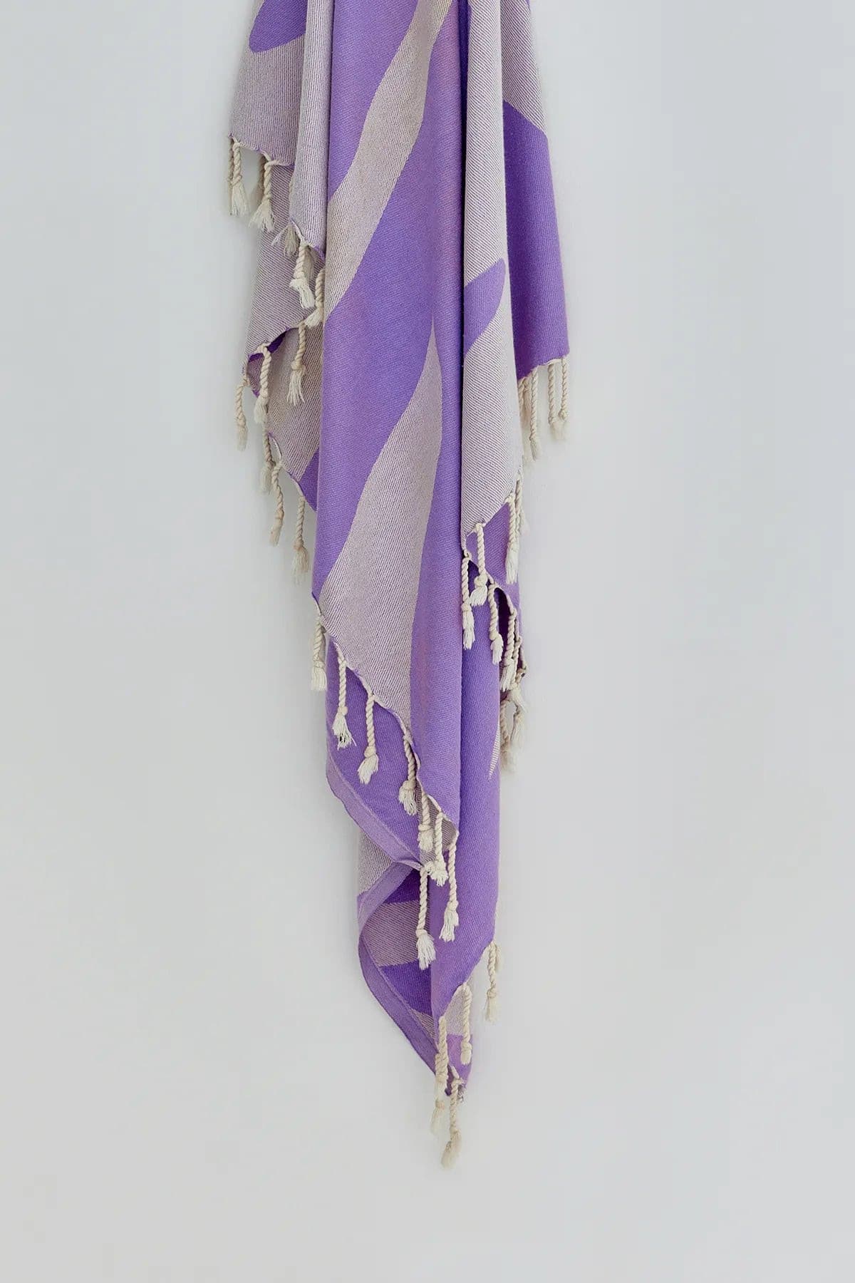 Fiori Turkish towel in Lilac – Close-up hanging towel highlighting weave and softness