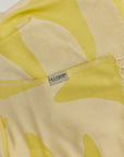 Fiori Turkish towel in Mellow Yellow – Close-up draped towel showing detail and texture