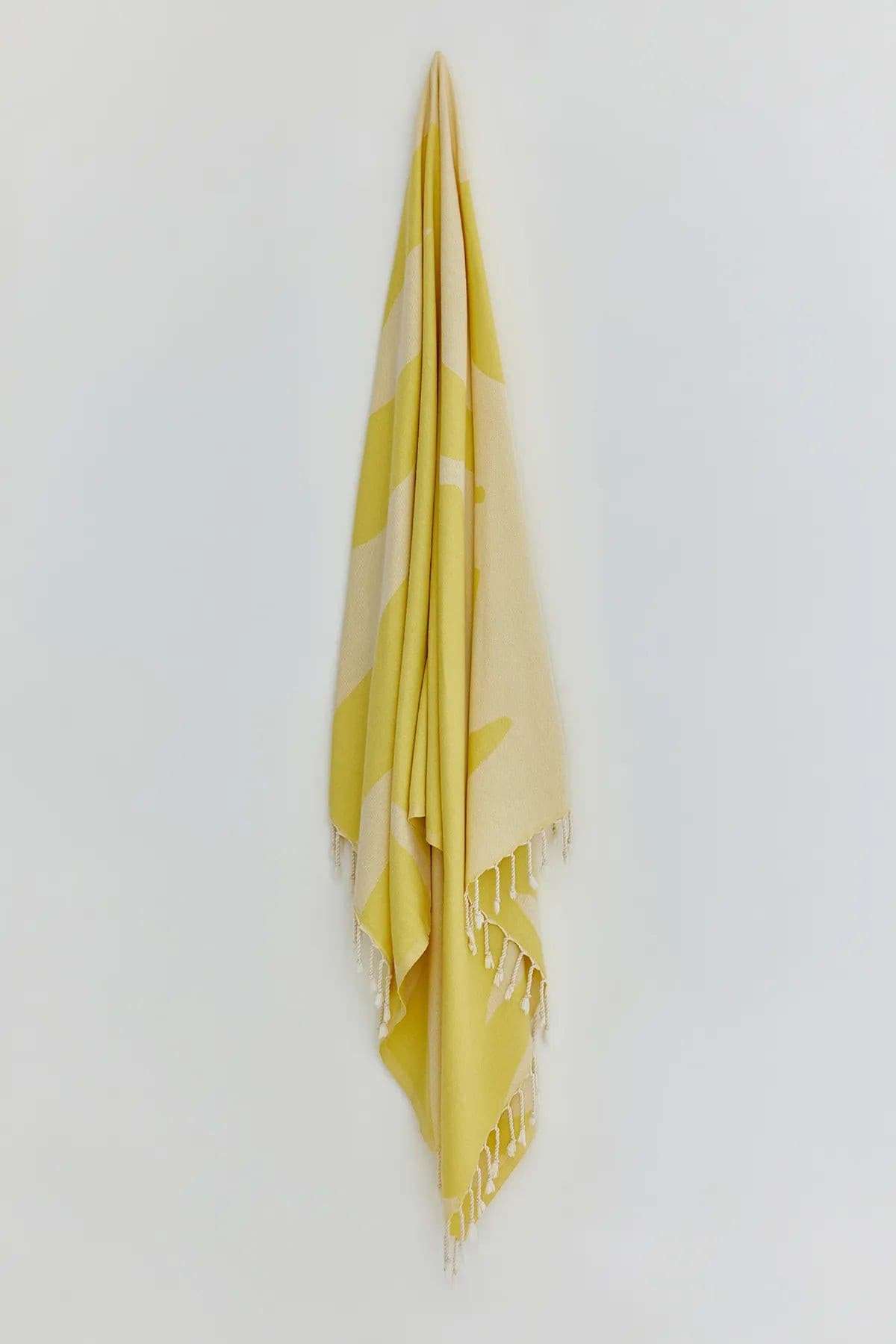 Fiori Turkish towel in Mellow Yellow – Full-length hanging view showcasing entire pattern and texture
